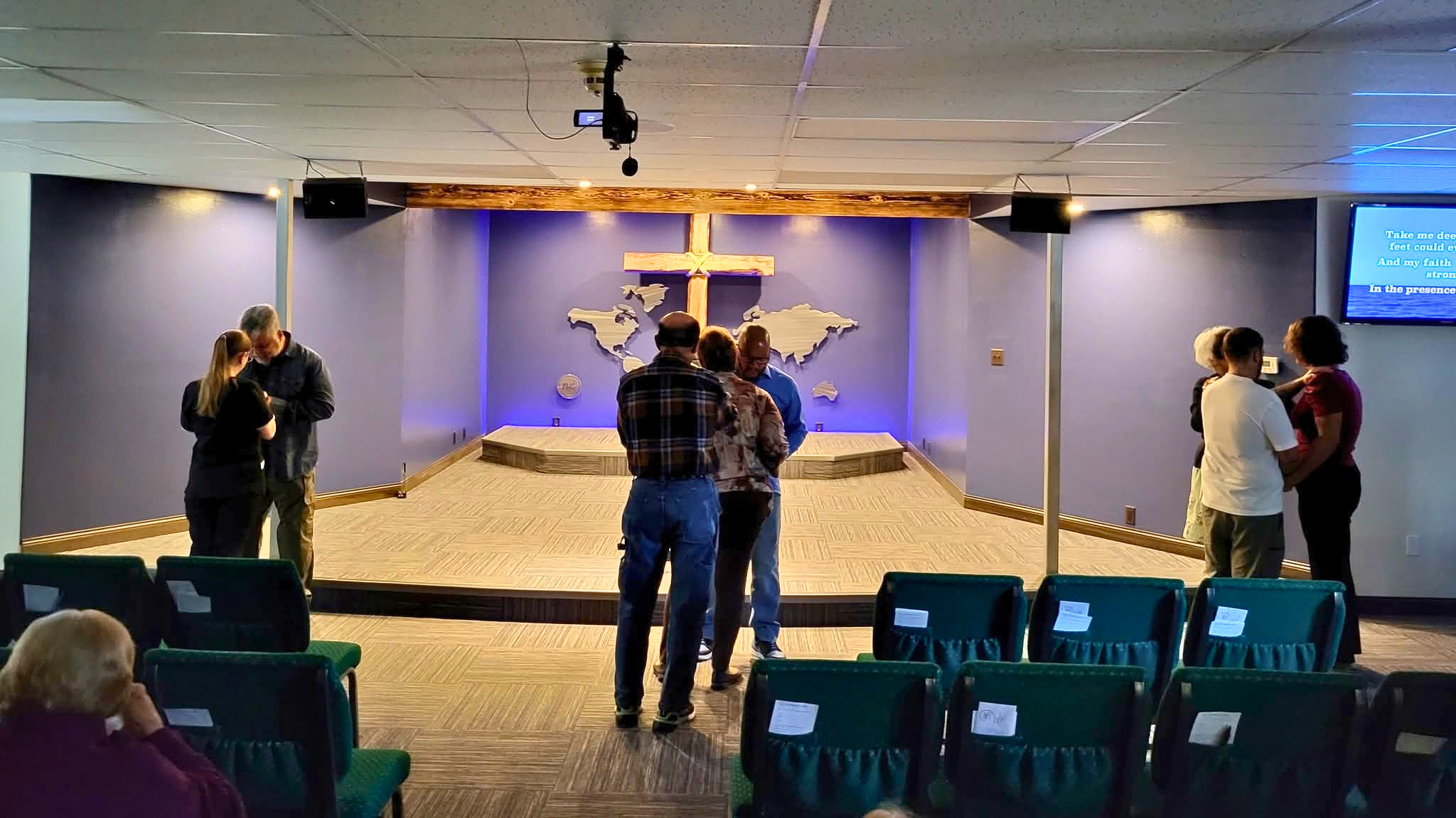 Prayer during a Sunday service at Freedom House Church